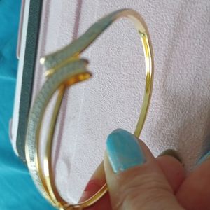 Gold tone with diamonds bangle bracelet will last you like it was 14k